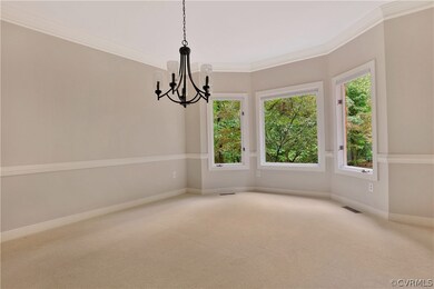Banquet size dining room with triple window facing