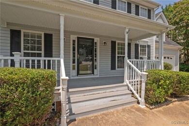 Entrance to property featuring a porch