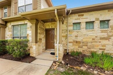 Property entrance featuring stone siding