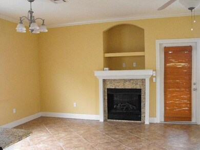 Living room and electric fireplace, rear exit to back porch.