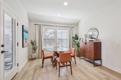 Dining room with recessed lighting, light wood look tile floors