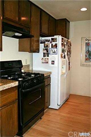 INVITING KITCHEN ALSO BOASTS PLENTY OF CABINETS