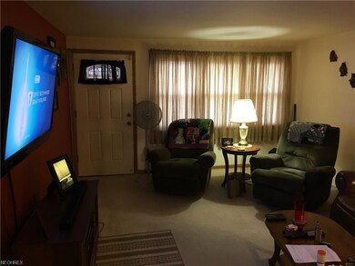 The front entry welcomes you into the living room.