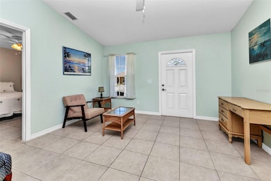 Living room with tile flooring throughout the home.