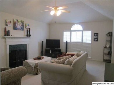 Living room has tall vaulted ceiling and transome 