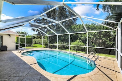 View of swimming pool with glass enclosure and a p