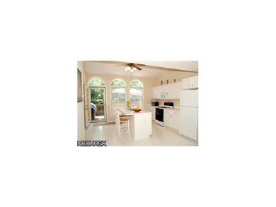 Large kitchen with oversized island with breakfast