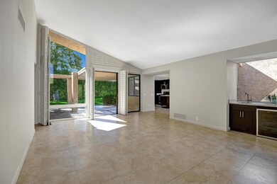LIVING ROOM ANGLED TO WET BAR AND BACK P