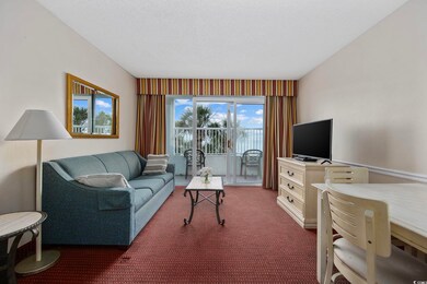 Living room featuring dark carpet