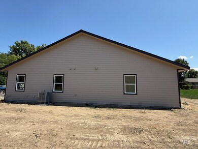 View of side of property with a central AC unit