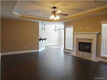 Large open great room with boxed ceilings
