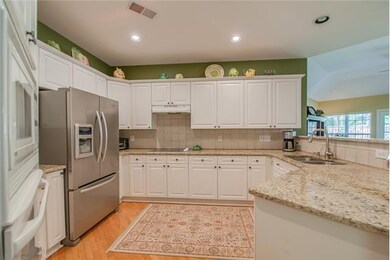 Granite tops and classic hardwood floors.