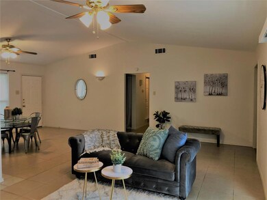 Front door on the left, middle hallway leads to be