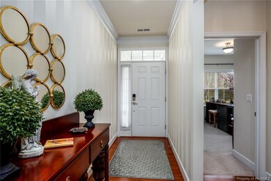 The Foyer has a custom painted neutral walls.