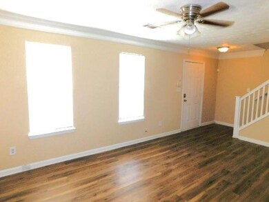 Empty room featuring ornamental molding, ceiling f