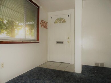 ENTRY AREA WITH CERAMIC TILE AND OPEN PARTITION.
