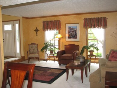 Living room is offered to the left