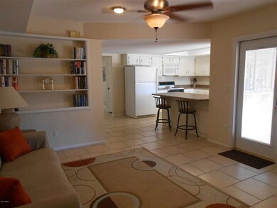 Family room w/ B/I bookcases