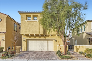 Mediterranean / spanish-style home with a garage,
