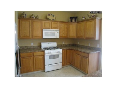 Kitchen open to the dining room and breakfast bar.
