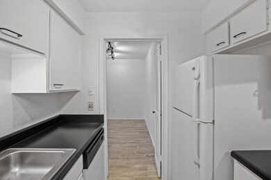 Light & bright kitchen opens to the dining area.
