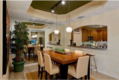 Dining room with kitchen opening.