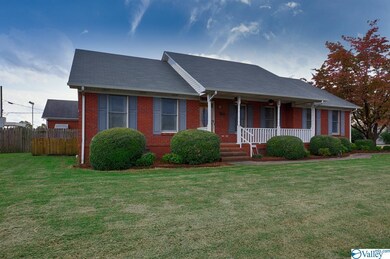 With covered front porch.