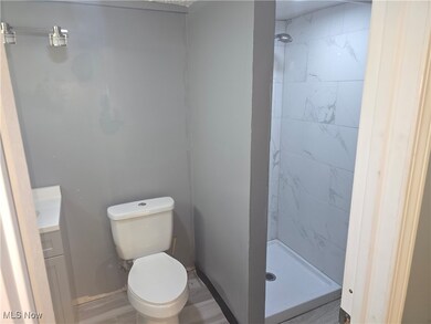 Bathroom with vanity and a shower stall