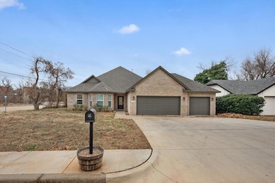 View of front of property with an attached garage, brick siding, concrete driveway, and roof with shingles