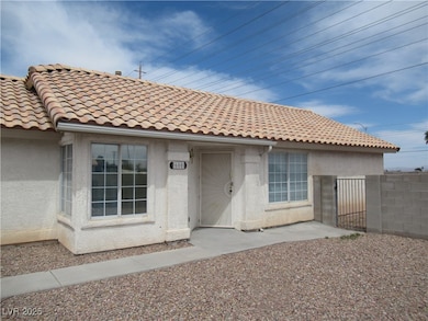 View of front facade with a tiled roof, stucco sid