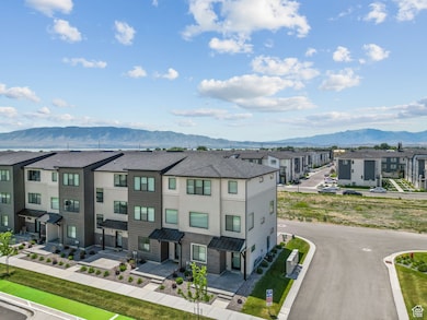 Aerial perspective of suburban area with a mountainous background