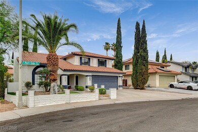 Mediterranean / spanish house featuring driveway, stucco siding, a garage, and a tiled roof