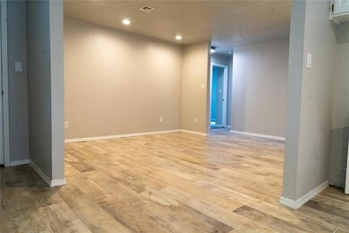Living room with recessed lighting, tile wood look floors