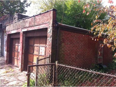 Parking Lot/Garage. brick detached garage in alley