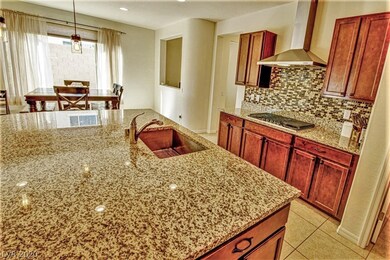 Well appointed kitchen boasts slab granite counter