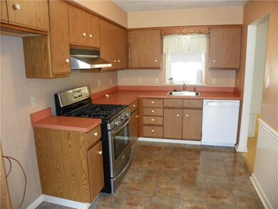 Well appointed kitchen. Window looks into mud room