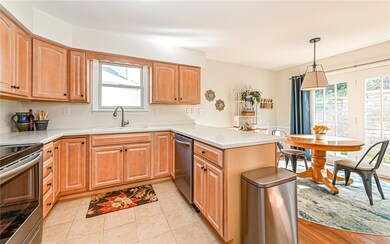 Newer maple kitchen cabinets with ceramic tile flo