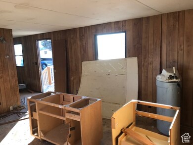 Miscellaneous room with wooden walls