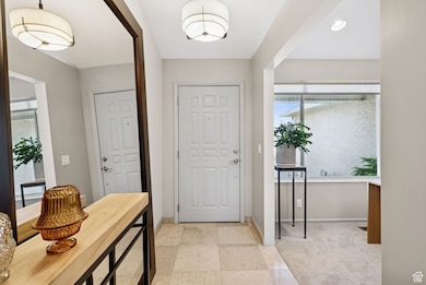 Foyer featuring baseboards and recessed lighting