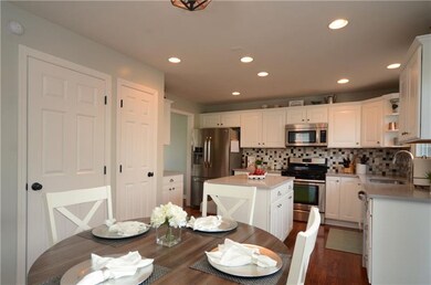 The kitchen includes recessed lighting and a pantr