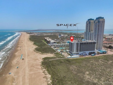 Drone / aerial view with a water view and a view of the beach