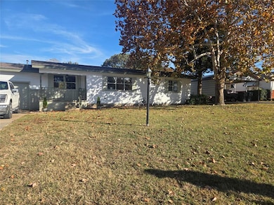 Ranch-style house with a front lawn