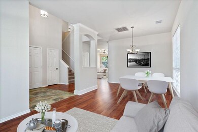 Living area with an inviting chandelier, wood fin