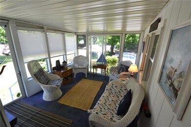 Inviting enclosed porch.