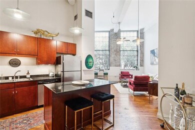 The kitchen has a practical island with stainless