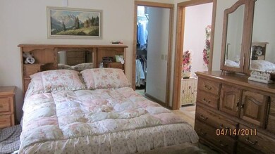 main bedroom with walk in closet & bath