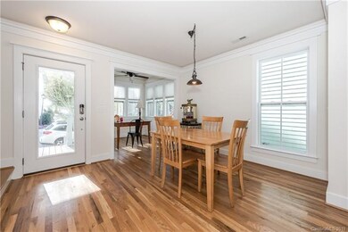 Dining Room with baseboards and crown molding
