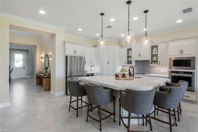 Kitchen featuring tasteful backsplash, crown moldi