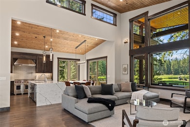 Expansive windows showcase golf course scenery.