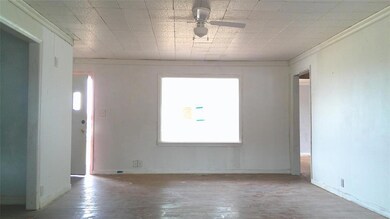 Empty room with ceiling fan and hardwood / wood-st